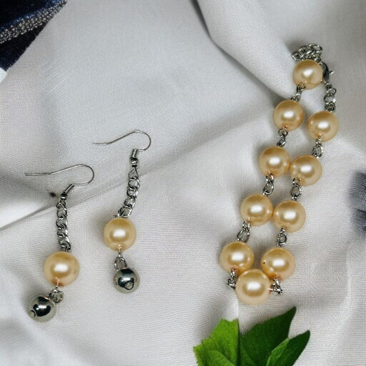 Bracelet et boucle d'oreille perlé rose